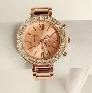Accutime women's cuff watch Rhinestones‎ around bezel. Rose gold